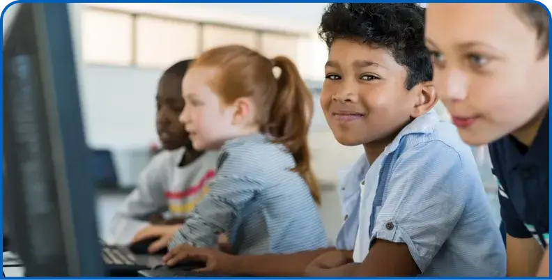 Students using computers in a K-12 classroom